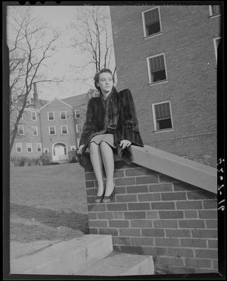 Gean Tye sitting on wall next to steps; (1940 Kentuckian)                             (University of Kentucky)