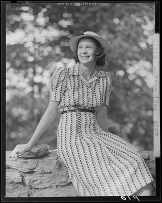 Peggy Weakley sitting on a stone wall; (1940 Kentuckian)                             (University of Kentucky)