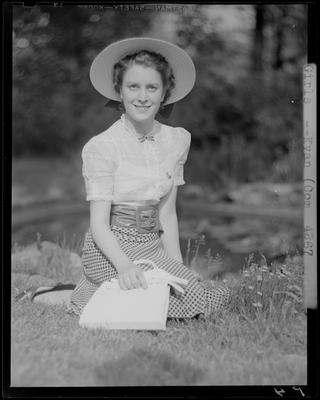 Mary Louise Weisenberger sitting on the grass (lawn); (1940                             Kentuckian) (University of Kentucky)