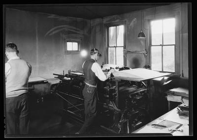 Man operating a printing press