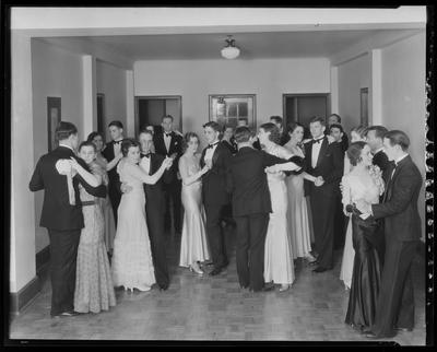 Couples in formal clothes dancing