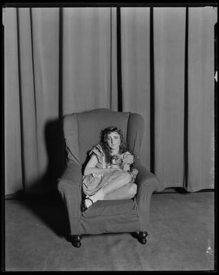 Young girl in stuffed chair (DAMAGED)