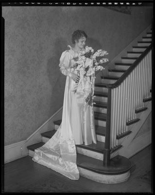 Young woman standing on stairway