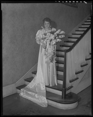 Young woman standing on stairway