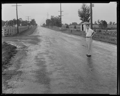 Man standing in middle of road