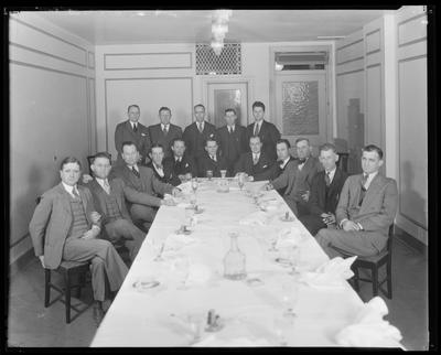 Men standing and sitting