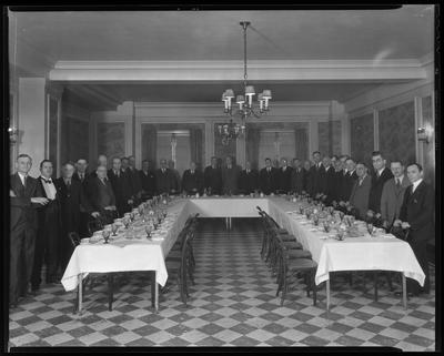 Group of men around u-shaped table