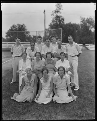 13 students, teacher posed outdoors