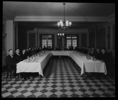 Men seated around a u-shaped table