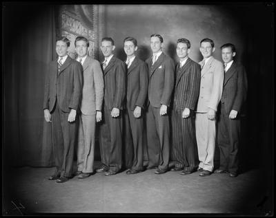 8 young men standing in line