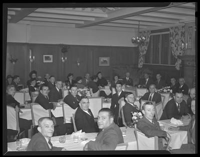 Businessmen, all sitting at tables