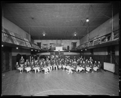 High school band in uniforms, on gym floor