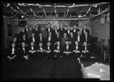 Group of 30 men in tuxedos