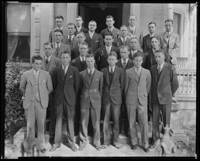 Young men posed on steps