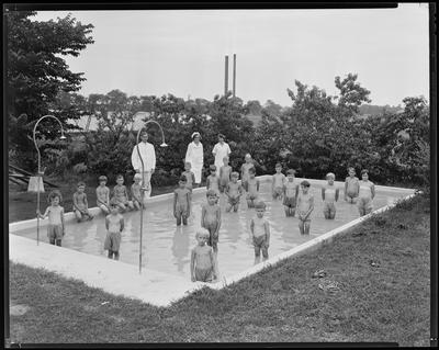 Young boys, girls in wading pool