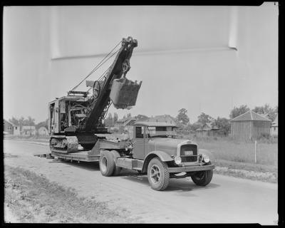 Flatbed truck, carrying a crane (1931)