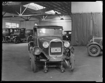 Ford pickup truck in shop (1930 license)