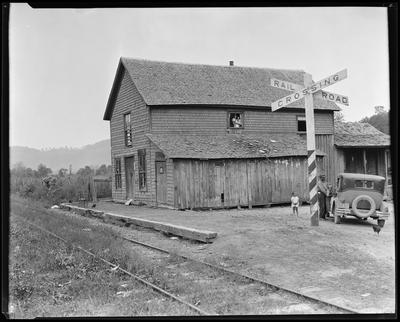 Dilapidated station at railroad crossing