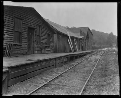 Dilapidated buildings by railroad tracks