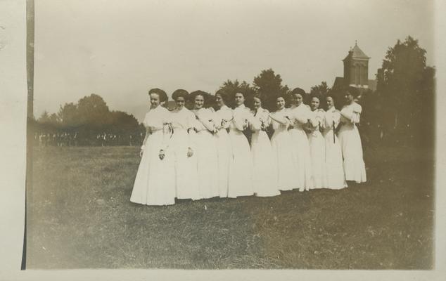 11 unidentified women in a line, appears to have been taken during the Flag Rush according to the 1910 yearbook circa 1910
