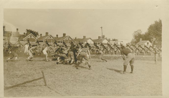 unidentified men playing football on a field