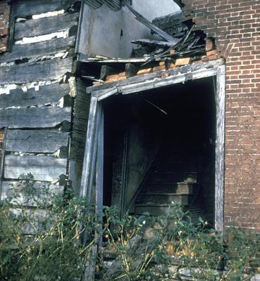 Entrance Detail Log and Brick House - Note on slide: View of Doorway and Staircase