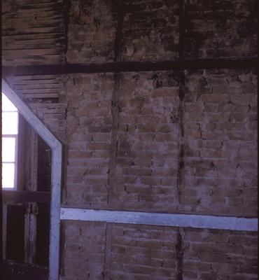 First Story, North Room Family House - Note on slide: Interior View of Brick Wall and Window