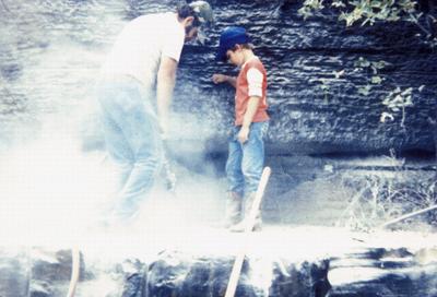 Stanley Kelly quarrying stone - Note on slide: View of stone quarrying