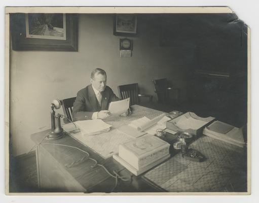 Unidentified man, seated