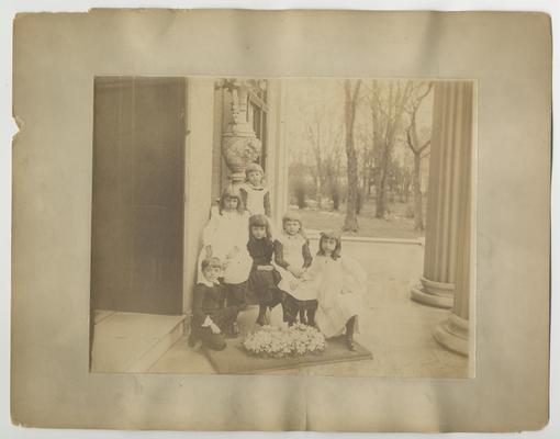 Unidentified group of children on porch of Bell Place