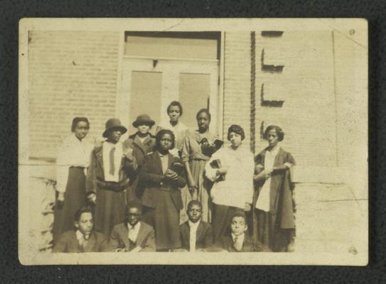Group photo of unidentified black men and woman, note on back reads second Normal Bible Class