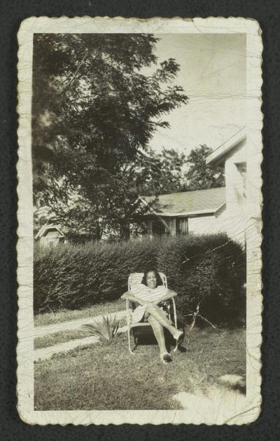 Mrs. Ruth Gaylor sitting in lawn chair