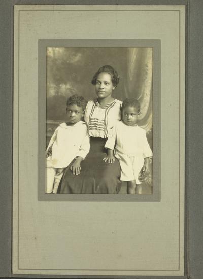 Portrait of an unidentified black woman and two children