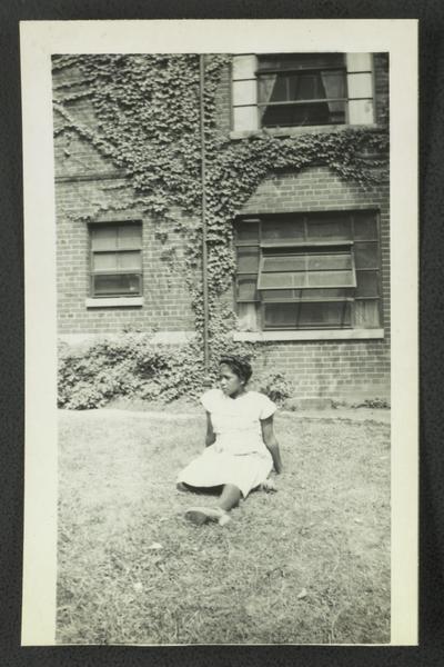Louise M. Stewart lounging in yard