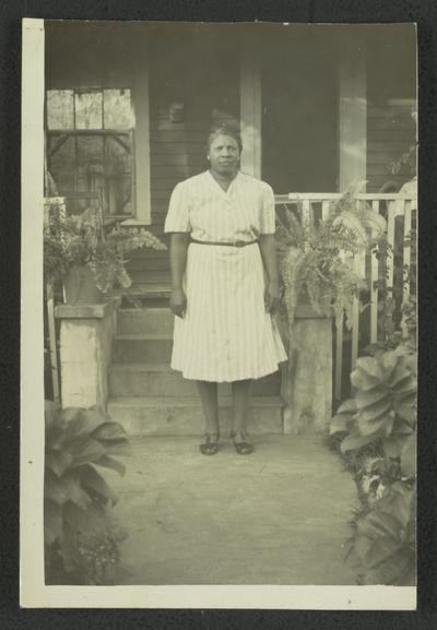 Mrs. Sylvesta Herman, Bay St. Louis, Miss. A friend of Mrs. Maurice; Sylvesta standing on steps leading to porch on house