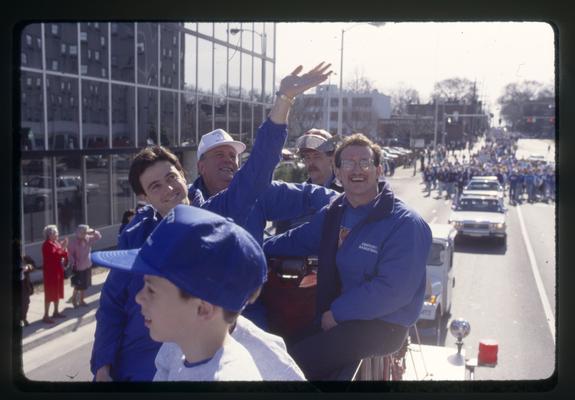 Rick Pitino and Bill Keightley wave to the crowd in UK parade