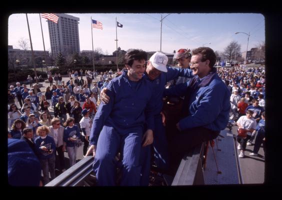 Rick Pitino and 2 unidentified men in UK Parade