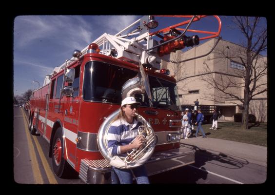 UK band member in front of fire truck at UK Parade