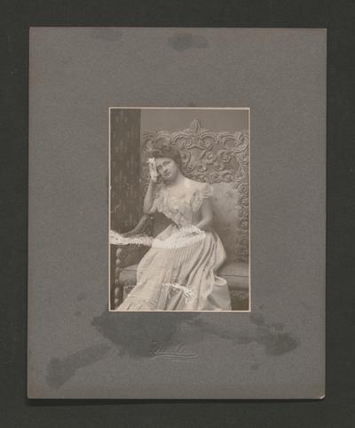 Young woman sitting in an ornate chair; Mullen, Lex., KY