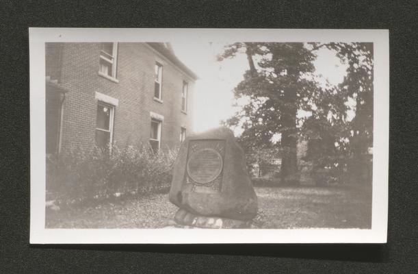 Marker on lawn of two-story building