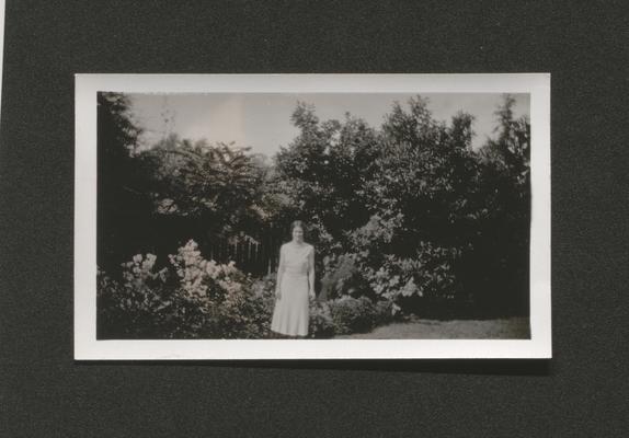 Woman standing in a garden