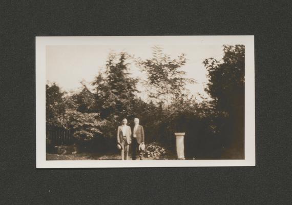 Samuel M. Wilson and a man standing next to a sundial