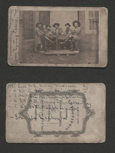 Group of Morgan's Men while prisoners of war in Western Penitentiary, Pennsylvannia; written in ink along edges of backing card: 'The Happy Family' of cell 401 Western Penitentiary; it also numbers the five men pictured playing cards left to right as: 1, 2, 3, 4, 5; on the back written in ink: No. 1 Captain W. E. Curry, Winchester, KY / No. 2 Lt A. J. Church, Lexington KY / No. 3 Adjt. Lee Hathaway, Mt. Sterling, KY / No. 4 Lt H. D. Brown, Lancaster, KY / Lt. Wm. Hays, Covington, KY / --For Mr. Caskey; Captain William E. Curry, 8th Kentucky Cavalry; Lieutenant Andrew J. Church, 8th Kentucky Cavalry; Lieutenant Leeland Hathaway, 14th Kentucky Cavalry; Lieutenant Henry D. Brown, 10th Kentucky Cavalry; Lieutenant William Hays, 20th Kentucky Cavalry; all were captured with John Hunt Morgan in Ohio