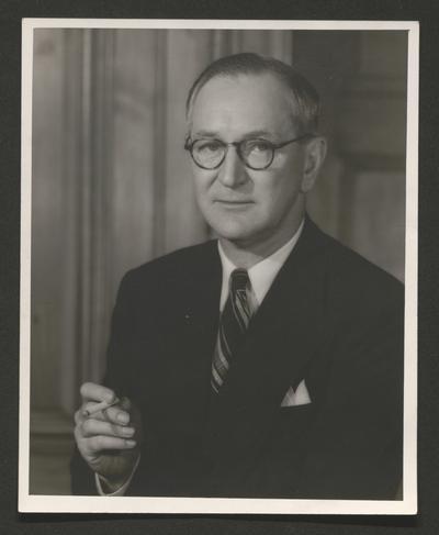 Portrait of a man holding a cigarette