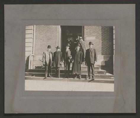 Samuel M. Wilson and four other men standing on the steps to a building