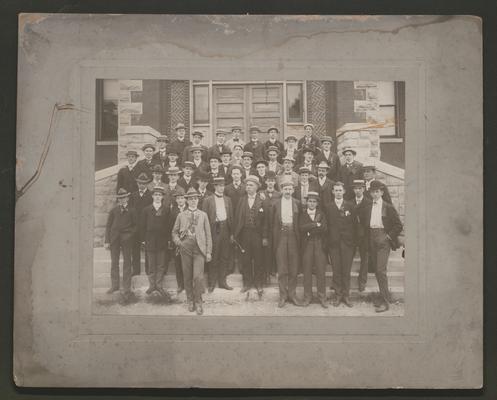 Large group of men on steps