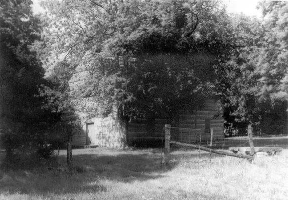 Side view of Cane Ridge Church, showing part of old graveyard, where many pioneer church-goers are buried. (Photo by John Buckner.)