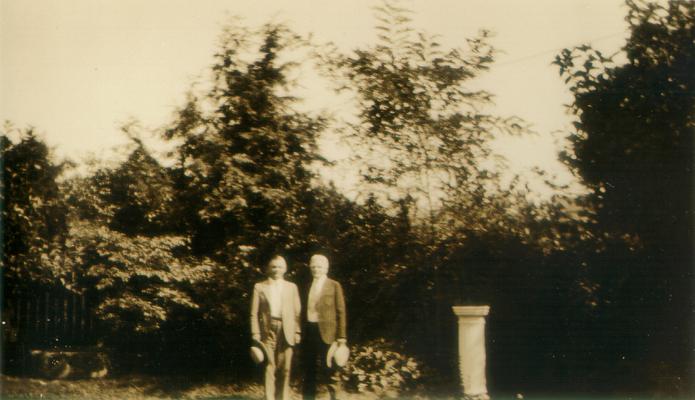 Samuel M. Wilson and a man standing next to a sundial