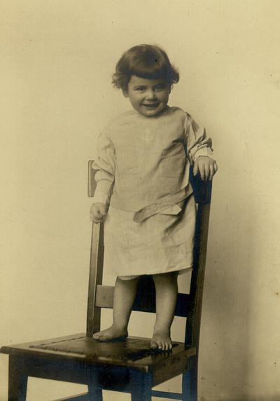 Child standing on a chair