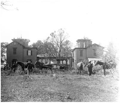 Glendower, McDowell-Preston home formerly located at 2nd street and Jefferson street, Lexington, KY, rear of house, Robert Wickliffe Preston (1850-1914) posed with horse, African-American groomsmen attend